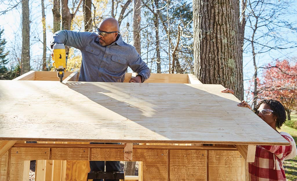A roof is attached to a treehouse using a nailer. A roof is attached to a treehouse using a nailer.