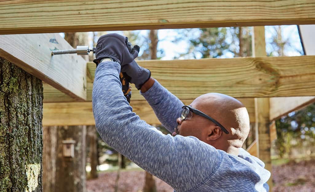 Joists are attached to deck boards. Joists are attached to deck boards.