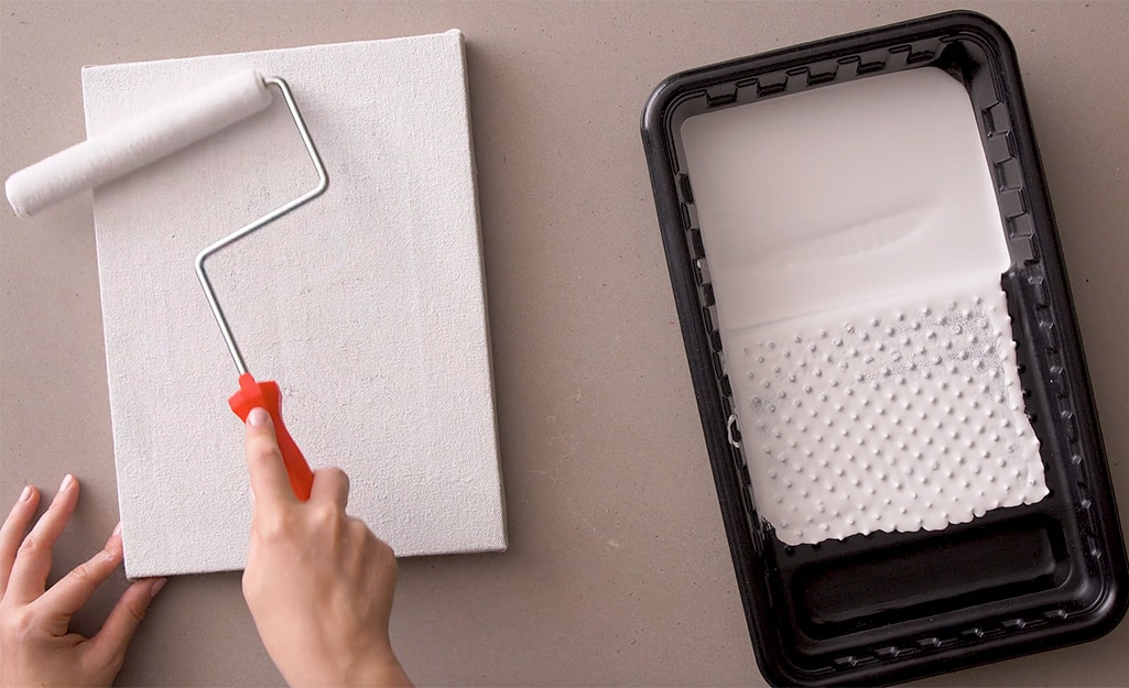 A canvas is painted with primer. A canvas is painted with primer.