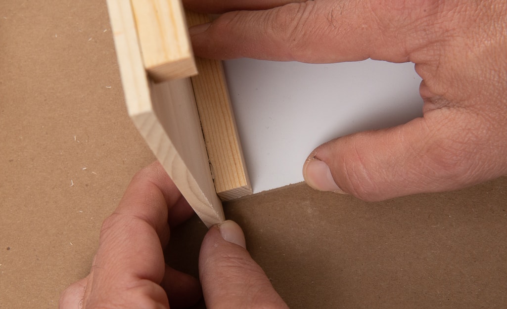 The sides of the dollhouse being attached too walls. The sides of the dollhouse being attached too walls.