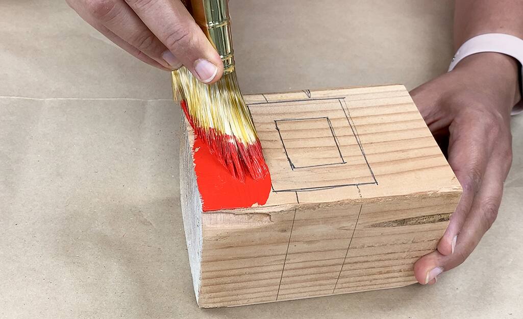 A block designed with Santa's belt is painted red. A block designed with Santa's belt is painted red.
