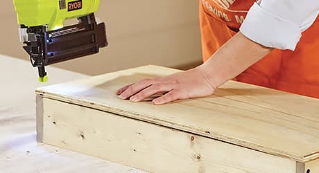 using a brad nailer to attach the plywood back to the frame using a brad nailer to attach the plywood back to the frame