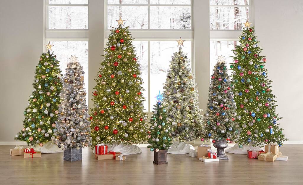 An array of artificial Christmas trees in a row. An array of artificial Christmas trees in a row.