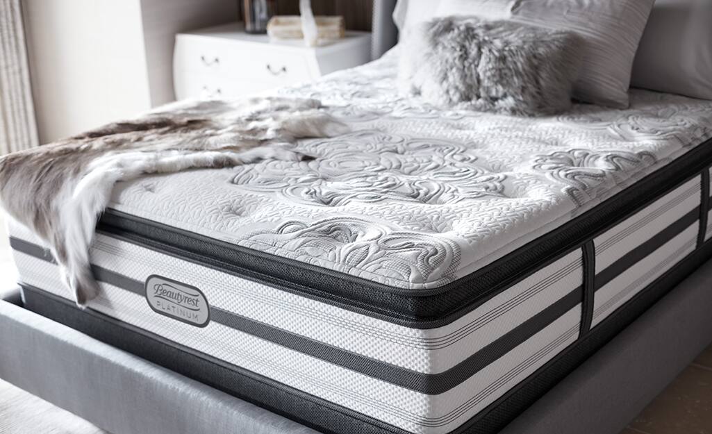 An innerspring mattress with an attached pillow top. An innerspring mattress with an attached pillow top.