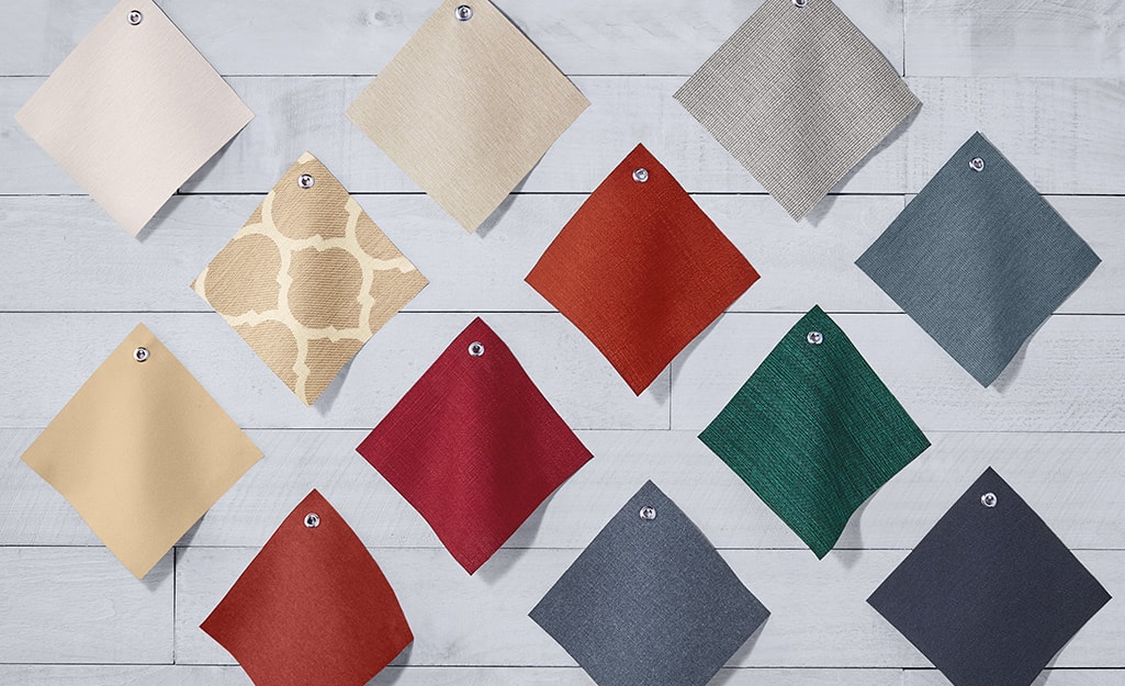 Swatches of different colored and patterned fabric. Swatches of different colored and patterned fabric.