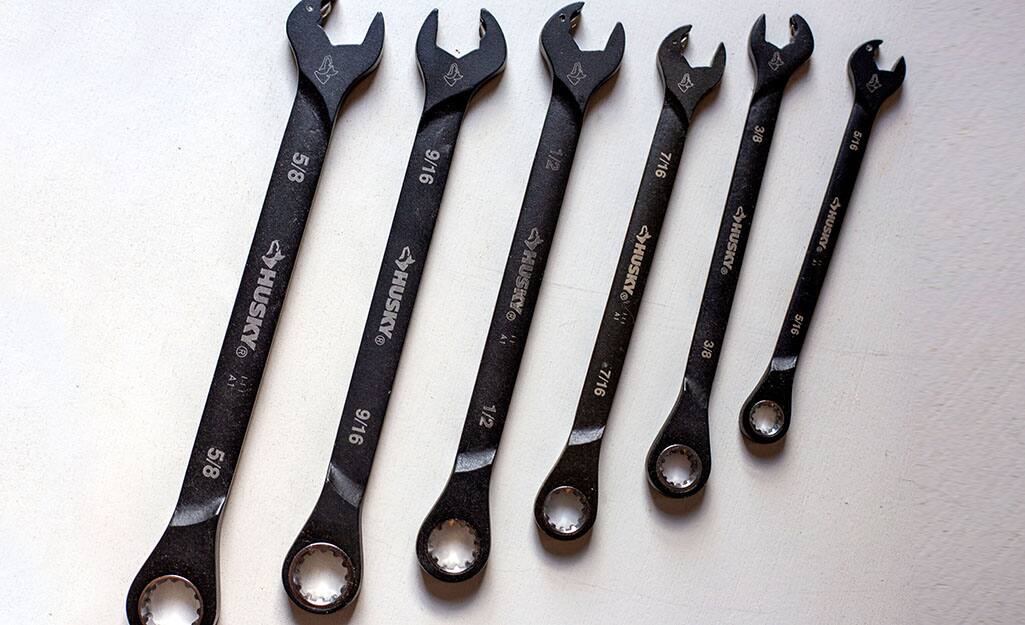 A set of wrenches is displayed on a counter. A set of wrenches is displayed on a counter.