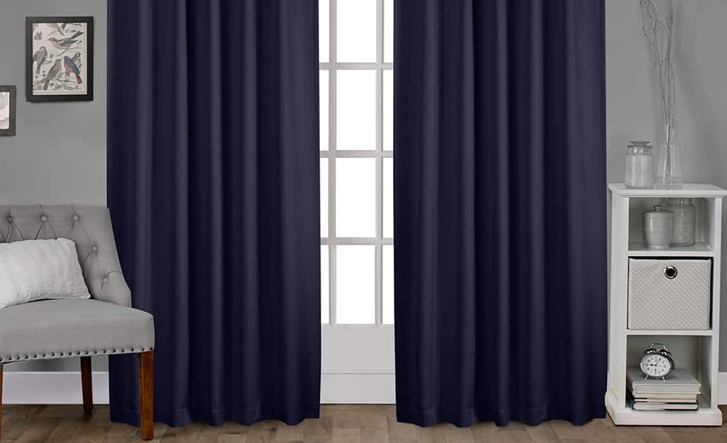 Blackout curtains over a bedroom window. Blackout curtains over a bedroom window.