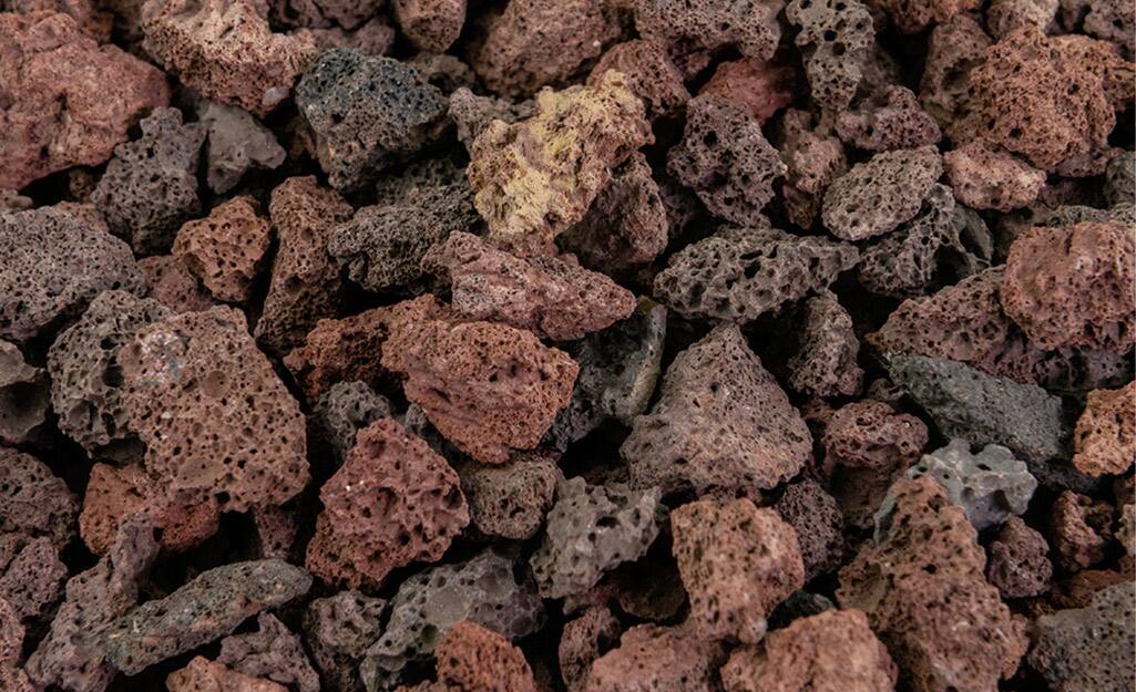 Lava rock spread on the ground. Lava rock spread on the ground.