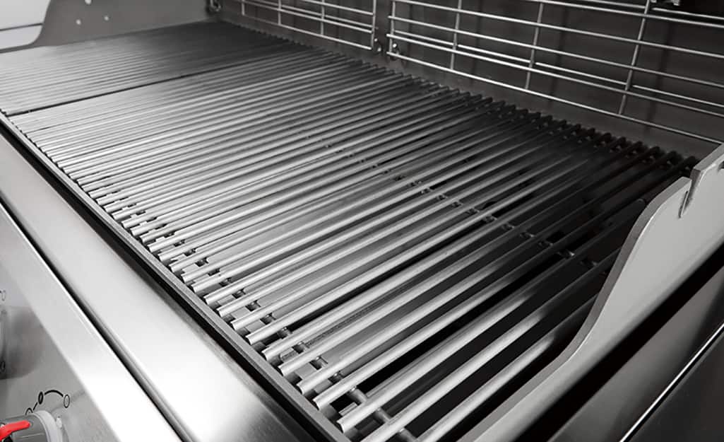 An open grill with clean grill grates. An open grill with clean grill grates.