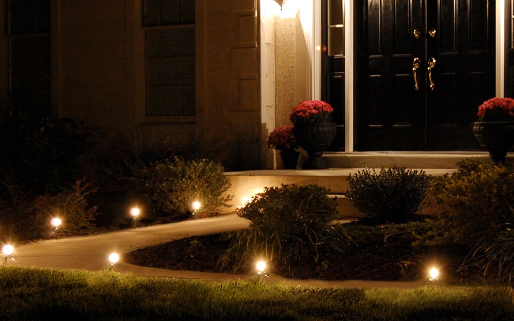 Pathway lights making a path to the front door. Pathway lights making a path to the front door.