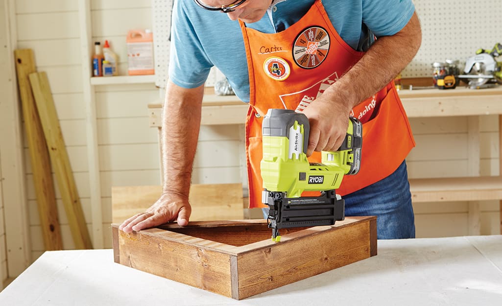 A man assembles the case. A man assembles the case.