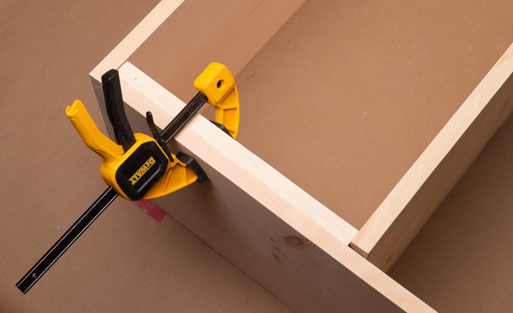 A clamped wood join drying. A clamped wood join drying.