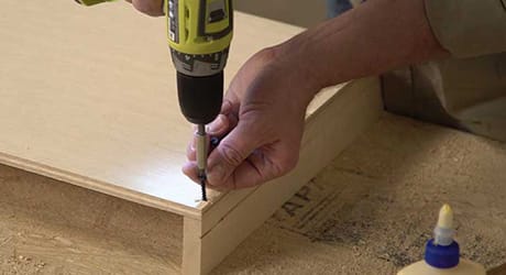Attach feet to bottom shelf Attach feet to bottom shelf