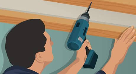Illustration of a man drilling top plates into the ceiling. Illustration of a man drilling top plates into the ceiling.
