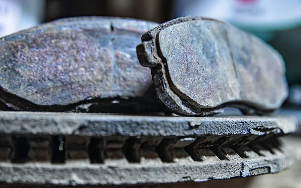 A close up of worn brake pads A close up of worn brake pads
