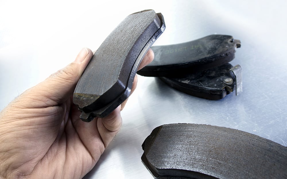 A person installing new brake pads A person installing new brake pads