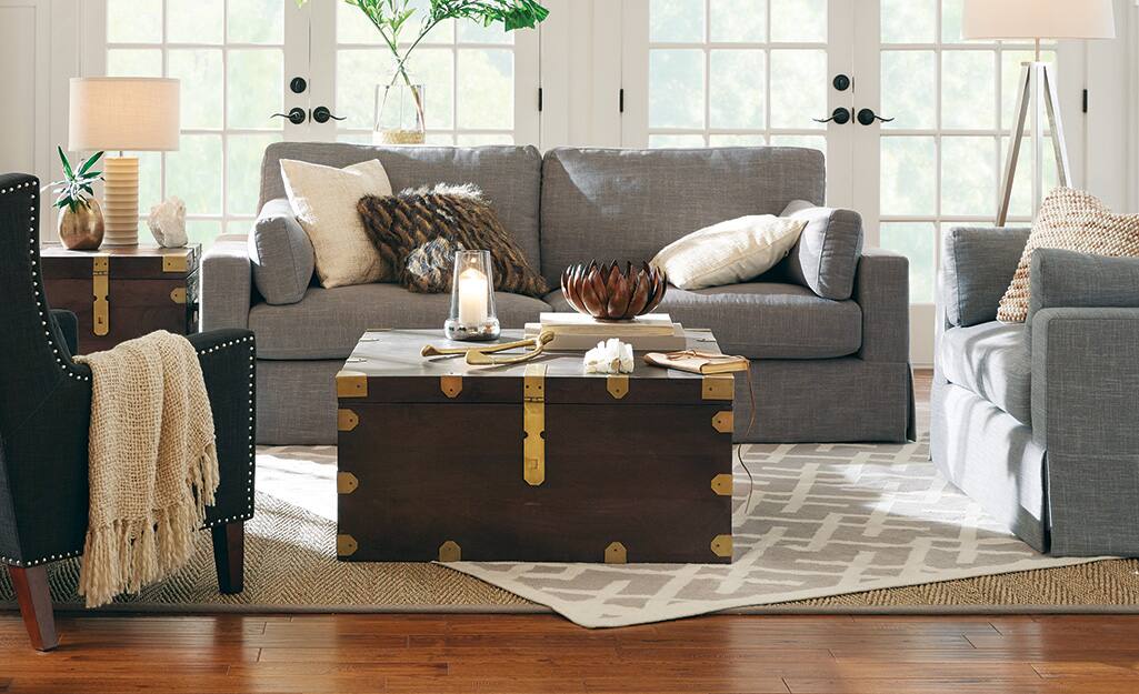 A living room with area rugs. A living room with area rugs.
