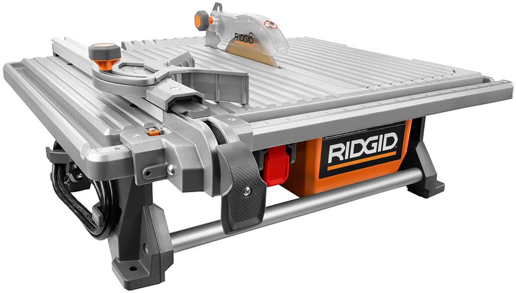 A wet saw for cutting tile on a white background. A wet saw for cutting tile on a white background.