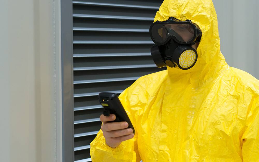 A man preparing the settings on a moisture meter A man preparing the settings on a moisture meter