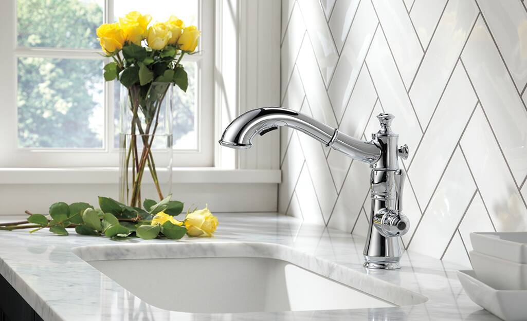 A single handle faucet in a kitchen.