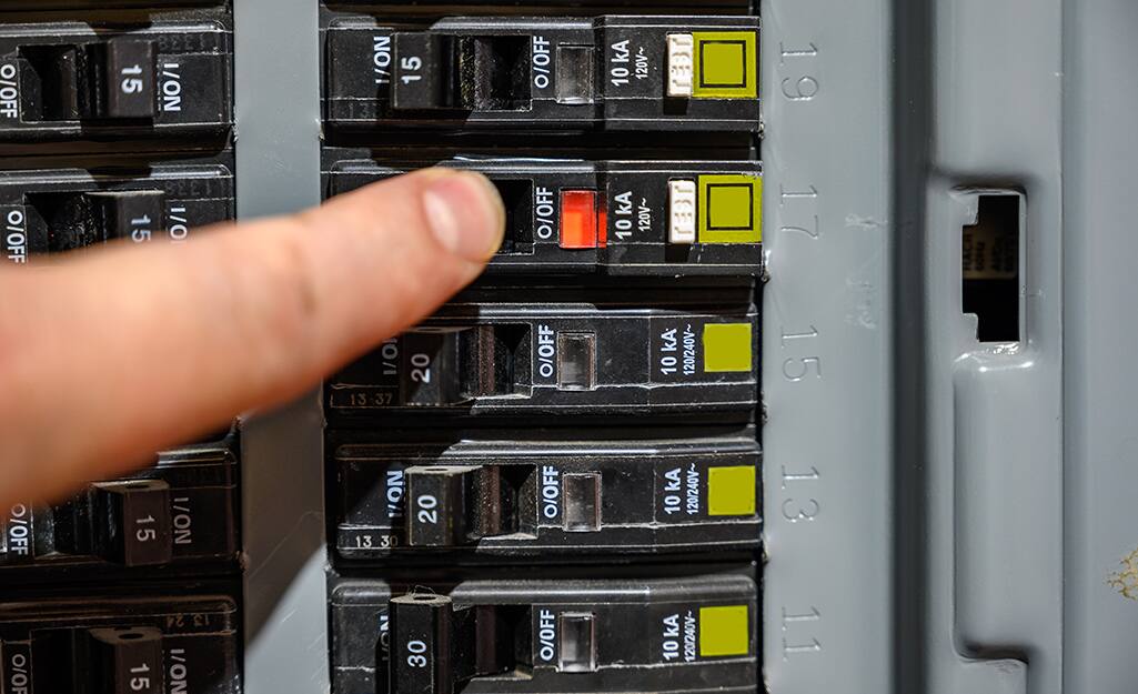 Someone turning off main electrical box. Someone turning off main electrical box.