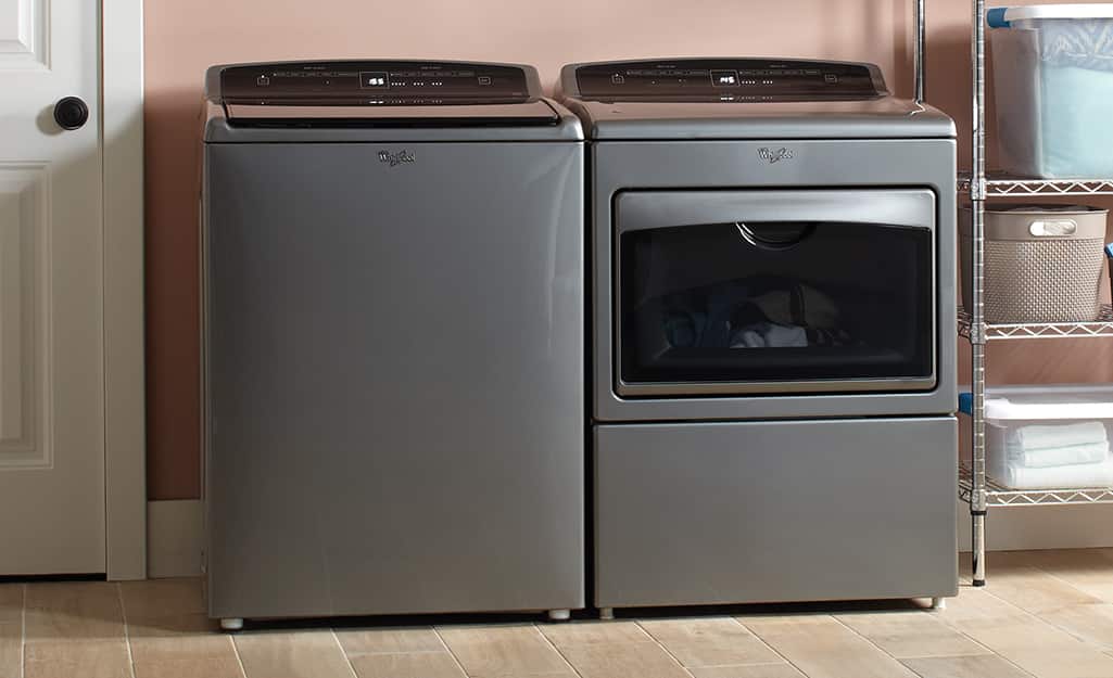 A washer and dryer with leveling feet in a laundry room. A washer and dryer with leveling feet in a laundry room.