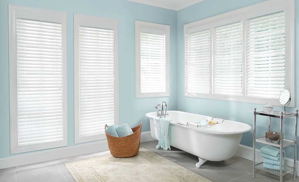Faux wood blinds on windows in a bathroom. Faux wood blinds on windows in a bathroom.