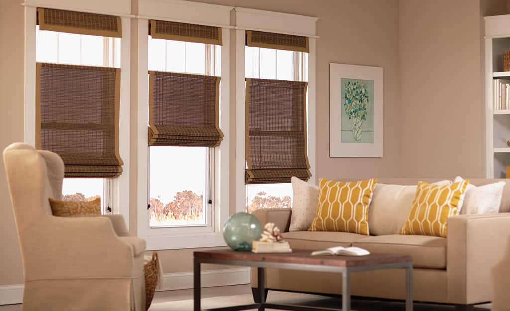 Woven shades on windows in a living space. Woven shades on windows in a living space.
