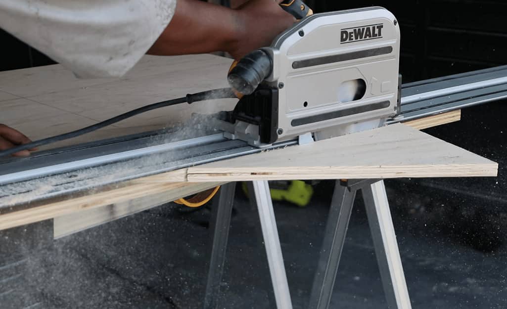 A smaller triangle is cut using a saw. A smaller triangle is cut using a saw.