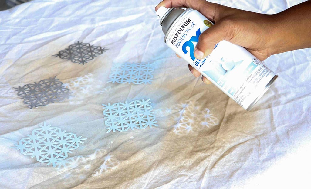 Metal snowflakes are painted blue. Metal snowflakes are painted blue.