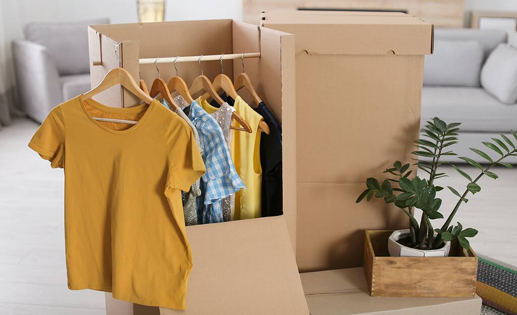 Clothes hanging in a wardrobe box. Clothes hanging in a wardrobe box.