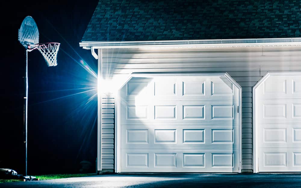 motion lighting in driveway at night with basketball hoop motion lighting in driveway at night with basketball hoop