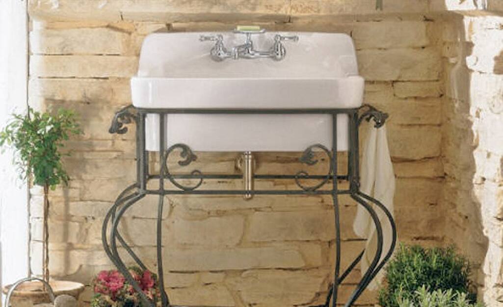A wall-mounted single bowl kitchen sink.