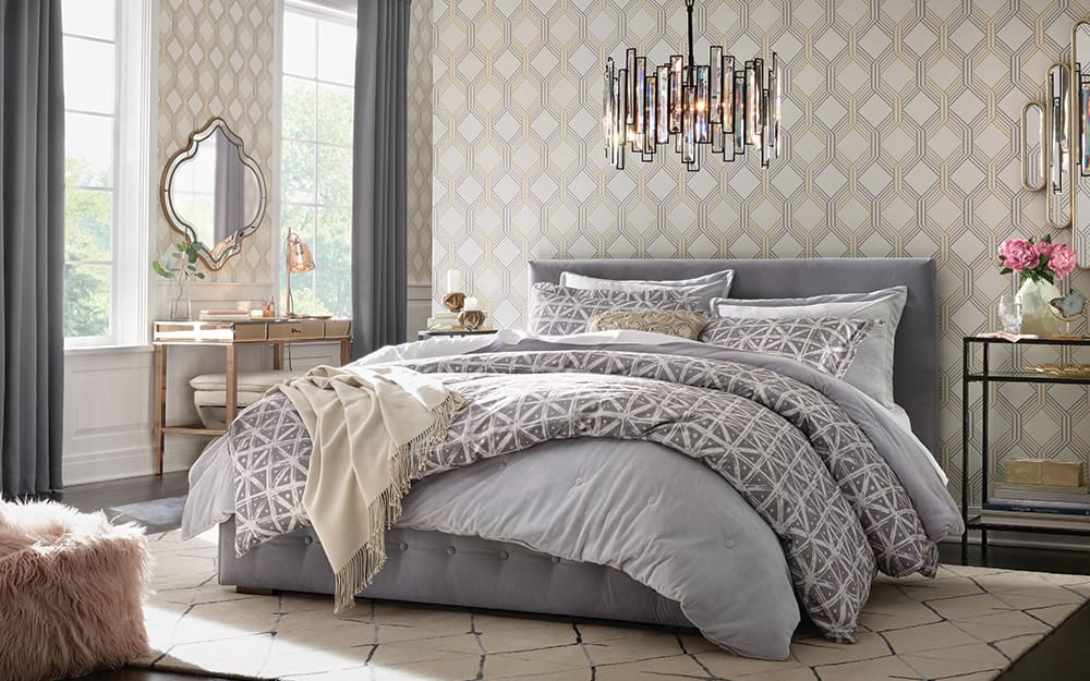 Master bedroom with a modern light fixture overhead. Master bedroom with a modern light fixture overhead.