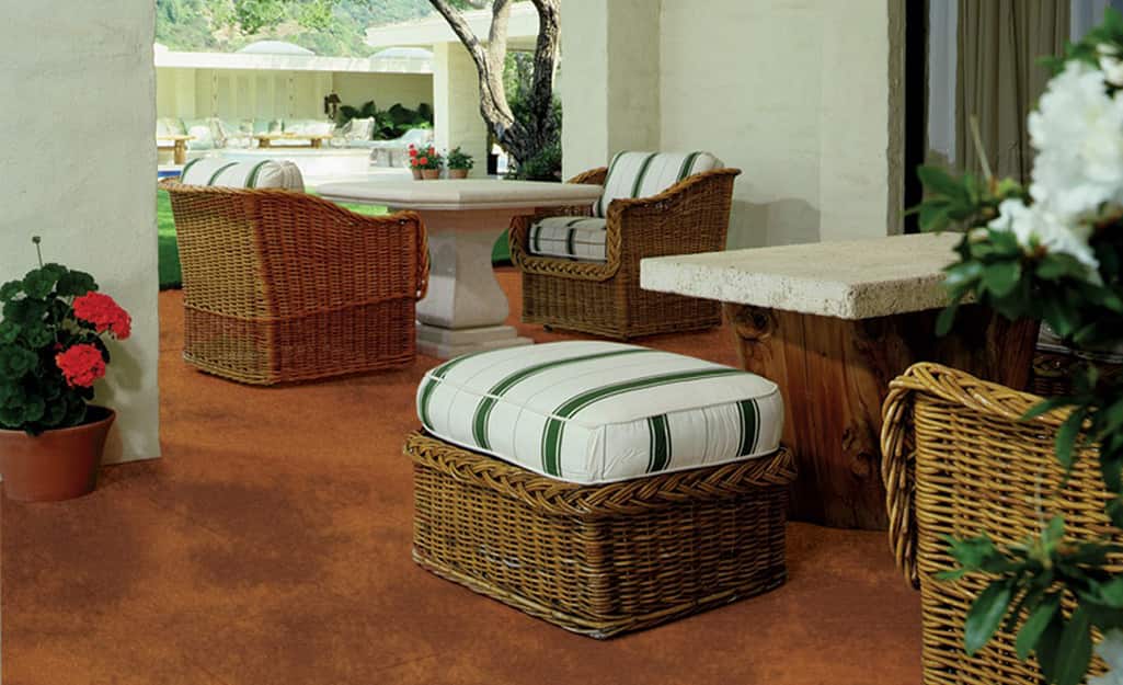 An outdoor concrete patio is stained with exterior concrete stain. An outdoor concrete patio is stained with exterior concrete stain.