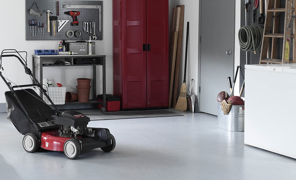 A workshop with a pristine, epoxy painted floor. A workshop with a pristine, epoxy painted floor.