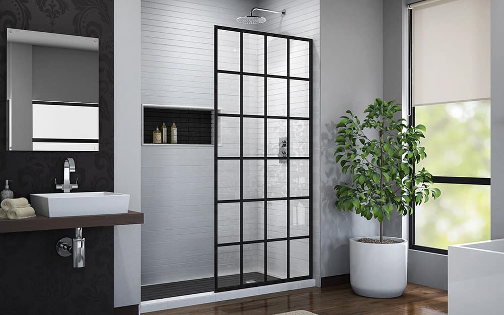 A barrier-free shower with a fixed shower door panel. A barrier-free shower with a fixed shower door panel.