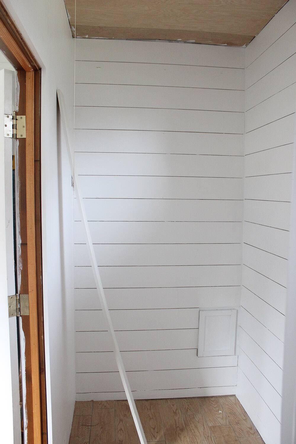 A wall with white planks.