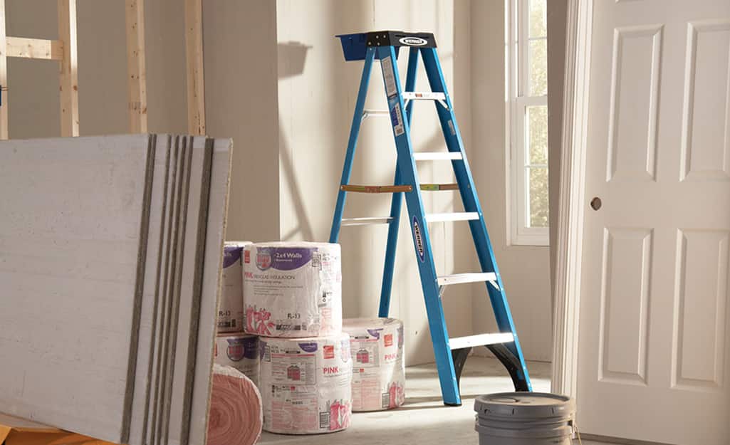 A blue aluminum step ladder. A blue aluminum step ladder.
