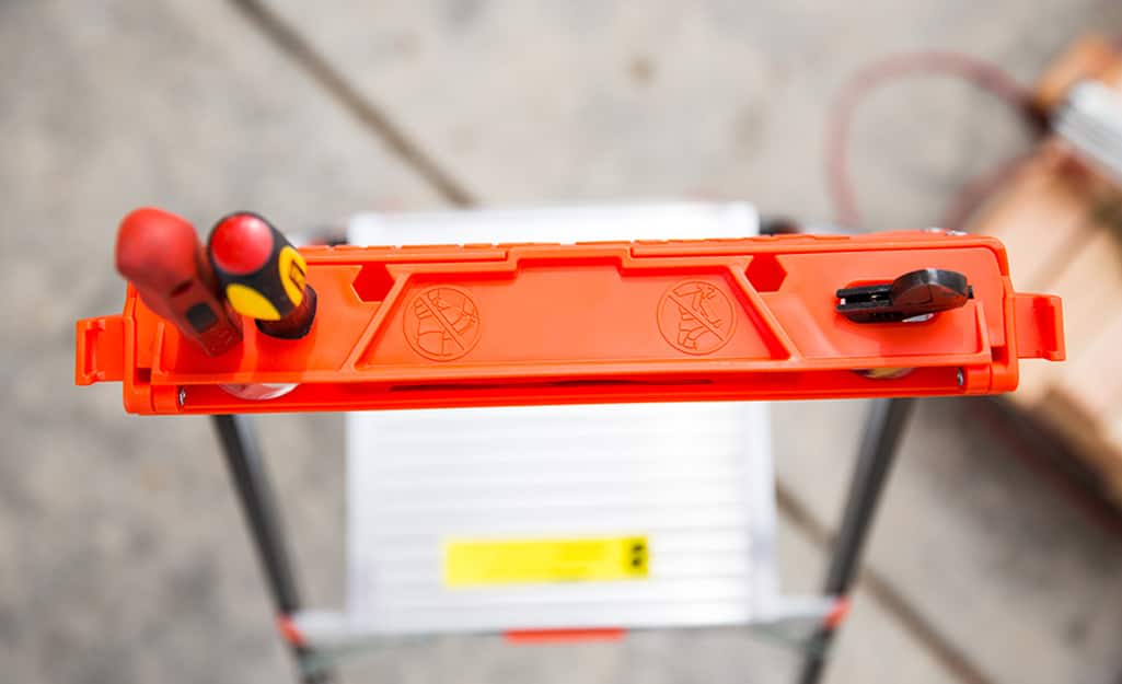 Top view of a ladder with a tool holder. Top view of a ladder with a tool holder.