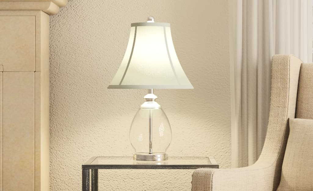 A lamp with a bell lamp shade. A lamp with a bell lamp shade.