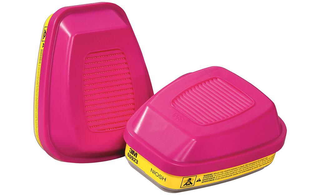 Pink respirator cartridges on a white background. Pink respirator cartridges on a white background.