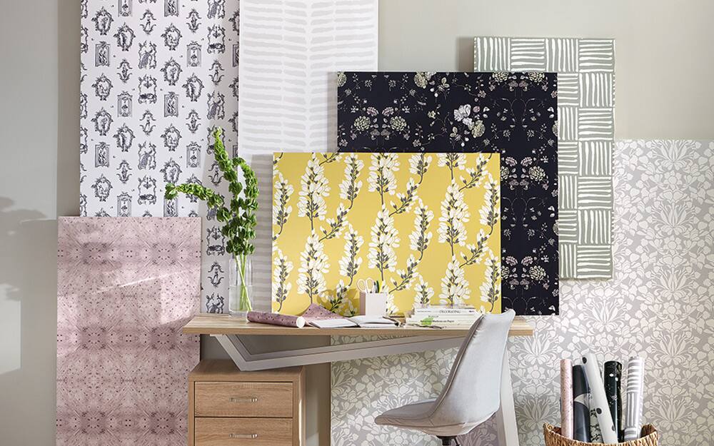 A sampling of different styles and colors of wallpaper that can be used as wall art.