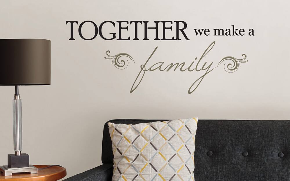 A stencil over a sofa used as wall art.