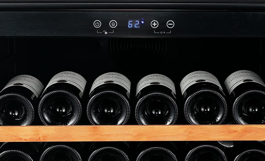 A wine cooler thermometer set to 62 degrees. A wine cooler thermometer set to 62 degrees.