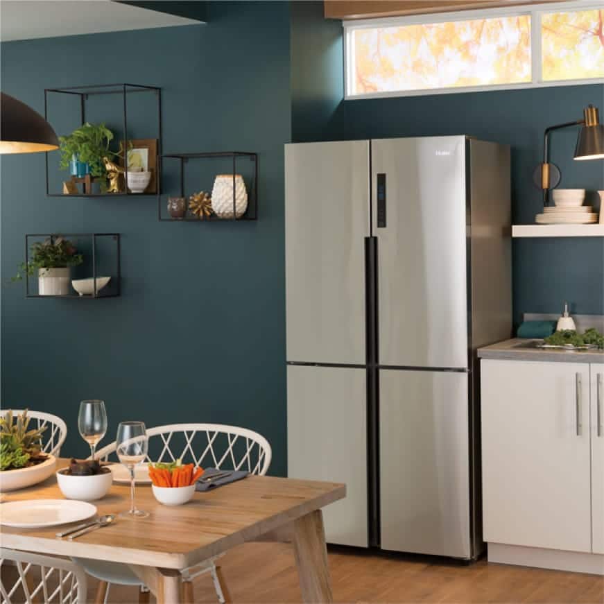 Picture of refrigerator in a kitchen set.