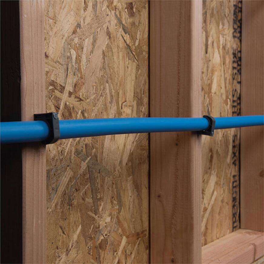 secure pipes to wall