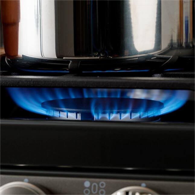Power boil burner on with saucepan over the flame