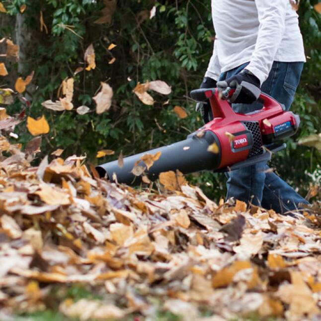 Lightweight blower blowing debris pile Lightweight blower blowing debris pile