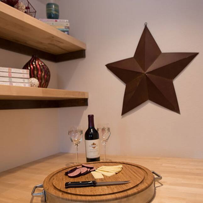 Dress up a wall by adding Hardwood Reflections Birch Butcher Block as open shelving.